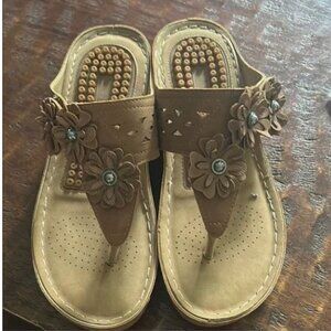 Women's wedge flip flop sandals with arch support.  Adorable with floral design.